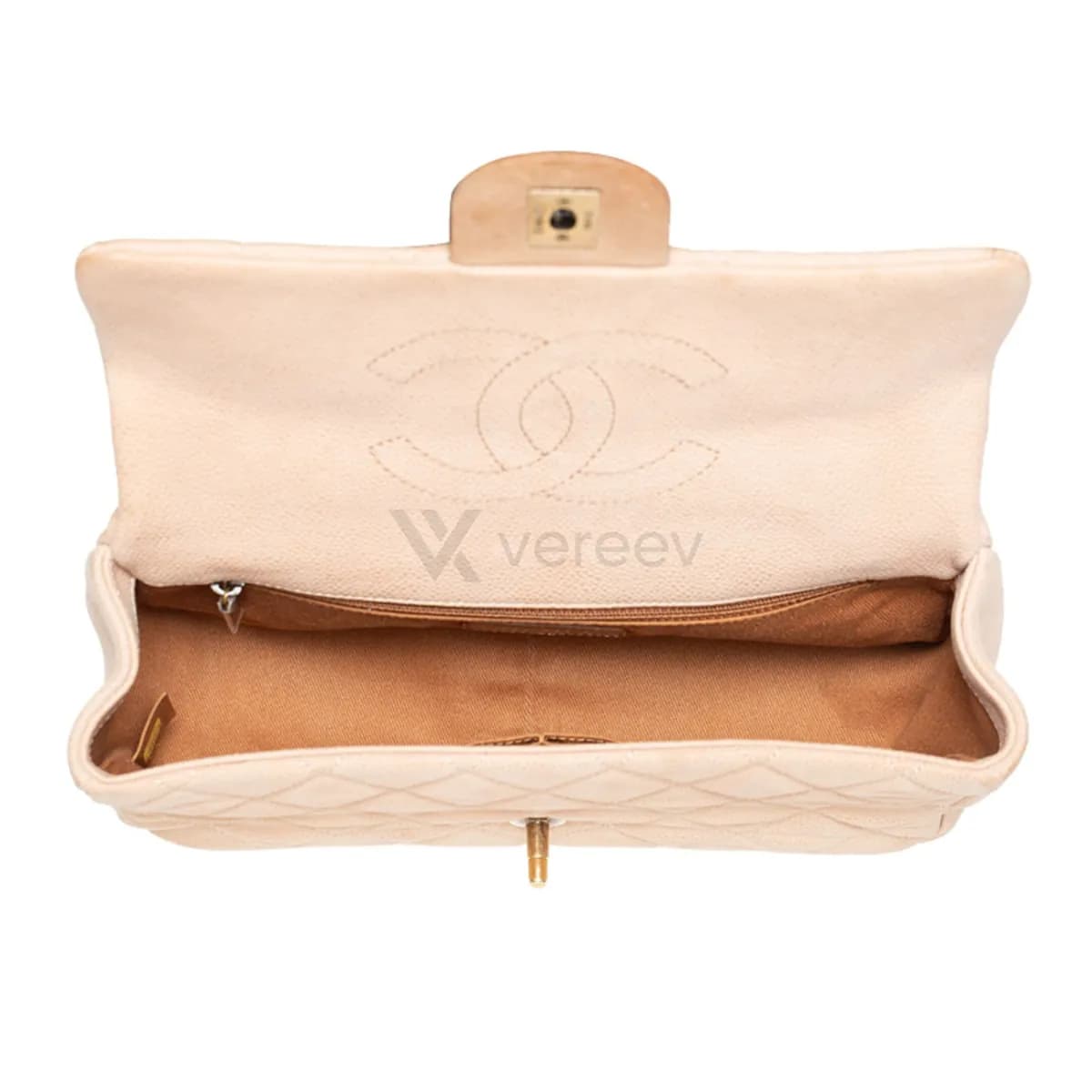 Sample photo 4, Interior: the open bag with its brown lining and the CC logo stitched inside the flap