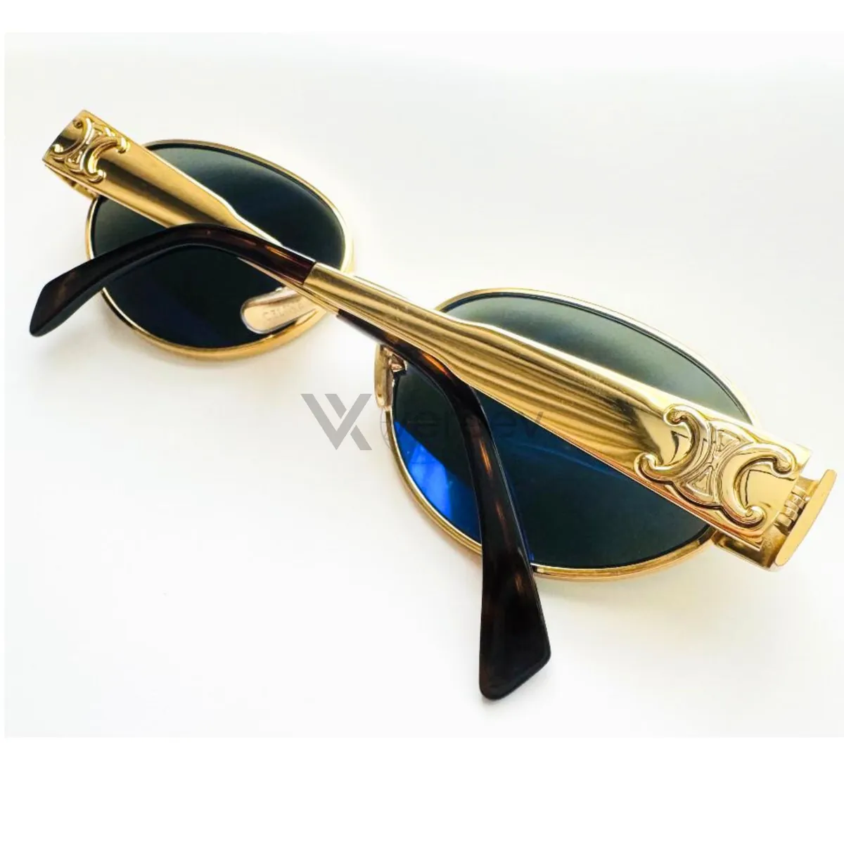 Sample photo 5, Back View: the folded sunglasses, showing the back of the frame and the temple logos